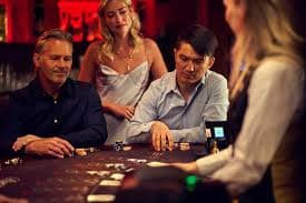 Lucky Neko live dealer studio with cards and betting zones visible on a mobile phone screen